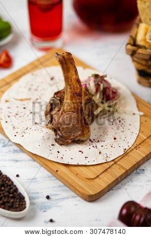 Beef Lamb Chop Meal In Lavash On Wooden Plate With Onion Salad ,bread, Vegetabels And Wine - Image