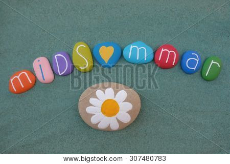 21 June, Celebrated With Multi Colored Stones Over Green Sand To Celebrate Midsommar In Sweden