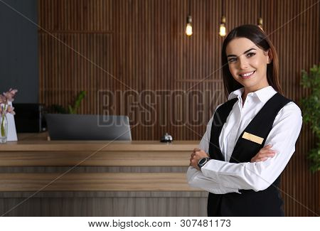 Portrait Of Receptionist At Desk In Lobby