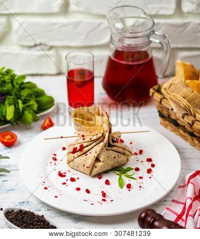 Lavash Snack Roll With Cheese And Grenate Seeds, Bread, Vegetables And Sorbet On A White Plate. Snac