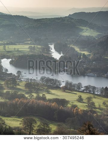 Beautiful Autumn Fall Landscape Image Of View From Gummers How Down Onto Derwent Wter In Lake Distri