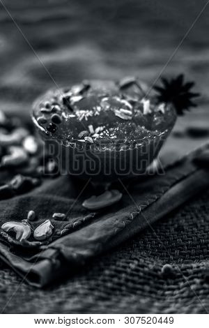 Famous Mango Preservation I.e. Murba Or Murabba In A Glass Bowl On Jute Bag's Surface Along With Dry