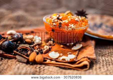Famous Mango Preservation I.e. Murba Or Murabba In A Glass Bowl On Jute Bag's Surface Along With Dry