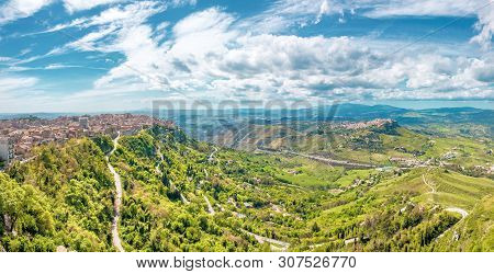 Panoramic View Of The Hills, The City Of Enna On The Right And The Valley With Green Luagmi And Fore