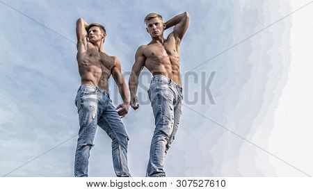 Sexy Torso Attractive Body. Denim Pants Emphasize Masculinity Sexuality. Men Twins Brothers Muscular