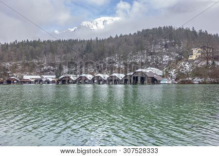 Scenery Including Lots Of Boathouses At Schoenau Am Koenigssee In Bavaria At Winter Time