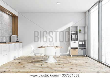 White Kitchen With Table And Bookcase