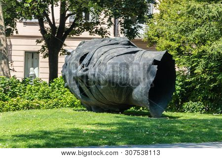 Lugano, Switzerland - June 1, 2019: Monument Shaped Head Called Eros Blindfolded Made By Igor Mitora