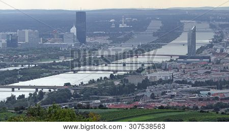 Vienna, Austria - August 24, 2014: Modern Skyscraper And The Wide Danube River