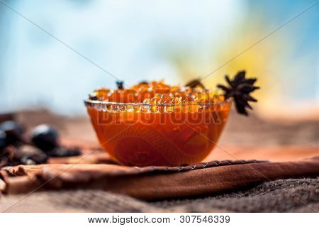 Famous Indian Dessert And Sweet Dish In A Glass Bowl On Jute Bags Surface I.e. Murabba Or Murba Alon