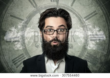 Bearded Surprised Man, Blowing Steam Coming Out Of Ears, Over Clock Background, Concept Of Transienc