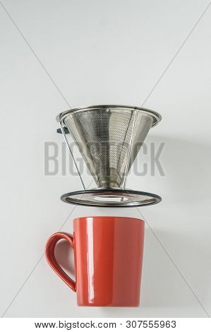 Red Coffee Mug On White Background With Filterless Metal Pour Over Drip Cone
