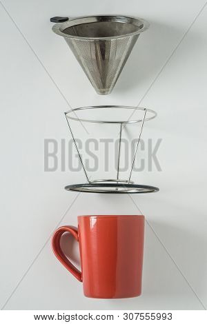 Red Coffee Mug On White Background. Metal Pour Over Drip Cone Pulled Apart.