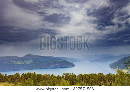 Norwegian Landscape. Green Mountains Hills And Fjord, Stormy Rainy Weather.