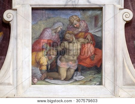FLORENCE, ITALY - JANUARY 10, 2019: The tomb of Michelangelo (detail). Pieta fresco by Giovanni Battista Naldini, Basilica of Santa Croce (Basilica of the Holy Cross) in Florence, Italy.