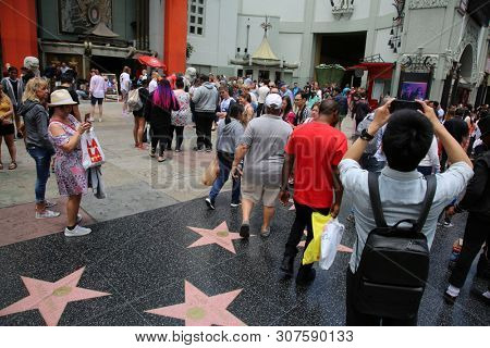 6/18/2019 Hollywood: California:  Tourist Visit Hollywood and enjoy sights, sounds, and smells of street performers and homeless alike on the streets of Hollywood in Los Angeles California. Editorial 