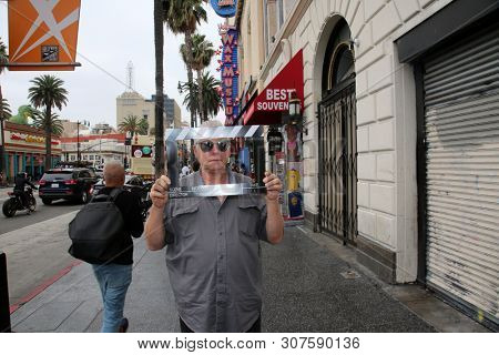 6/18/2019 Hollywood: California:  Tourist Visit Hollywood and enjoy sights, sounds, and smells of street performers and homeless alike on the streets of Hollywood in Los Angeles California. Editorial 