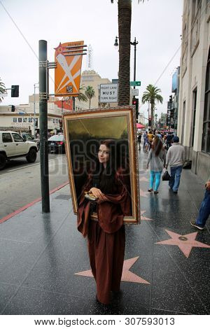 6/18/2019 Hollywood, California: Street Scenes of Hollywood California with street vendors, street performers, homeless, tourist, landmarks and various buildings with signs. Editorial Use Only. 