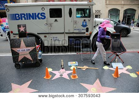 6/18/2019 Hollywood, California: Street Scenes of Hollywood California with street vendors, street performers, homeless, tourist, landmarks and various buildings with signs. Editorial Use Only. 