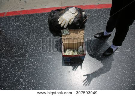 6/18/2019 Hollywood, California: Street Scenes of Hollywood California with street vendors, street performers, homeless, tourist, landmarks and various buildings with signs. Editorial Use Only. 