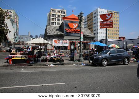 6/18/2019 Hollywood, California: Street Scenes of Hollywood California with street vendors, street performers, homeless, tourist, landmarks and various buildings with signs. Editorial Use Only. 