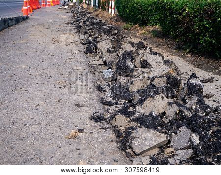 The Road Repairing Works With Jackhammer. Machine Drills Asphalt