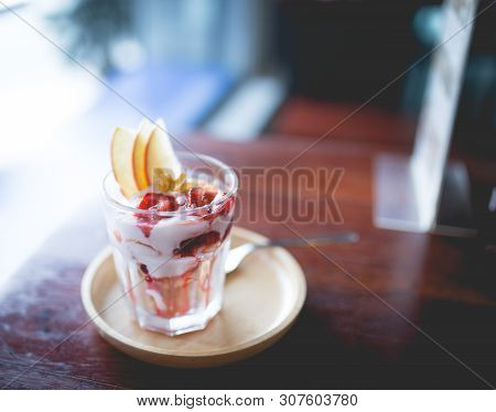 Picture Of A Homemade Fruit Yoghurt With Strawberry Jam, Apple And Conflake