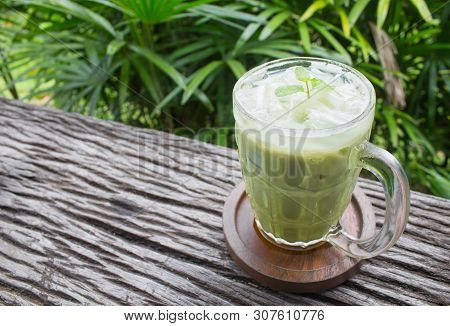 Cold Green Tea Milk Beverage Or Cold Drinks Right Frame Crosswise View. Green Cold Drinks And Ice On
