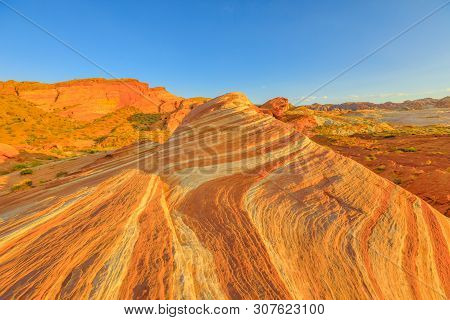 The Coloful Striped Landscape At Sunset Of Fire Wave Trail At Valley Of Fire State Park In Nevada, U