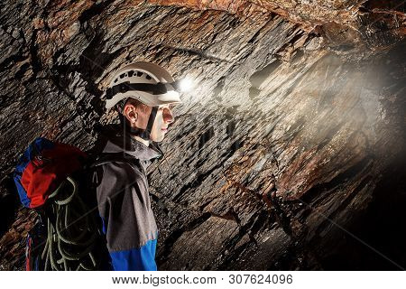 Young Speleologist Is Exploring A Dark Cave