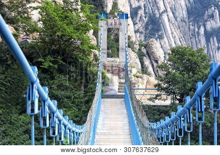 The Sky High Suspension Bridge On The Sanhuangzhai Plank Walk Way Within The Mount Song Scenic Area 