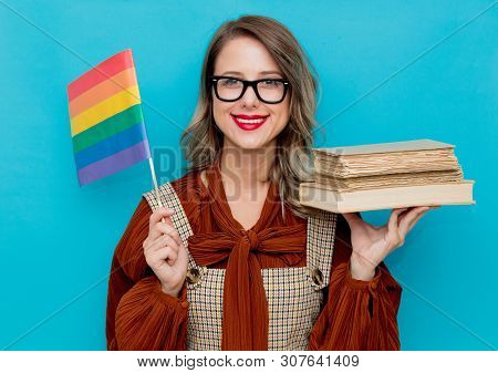 Young Woman With Books And Lgbt Flag On Blue Bckground