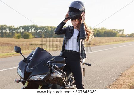 Image Of Beautiful Slender Young Risk Taker Sitting On Her Motorcycle, Having Trip On Her Vehicle, F