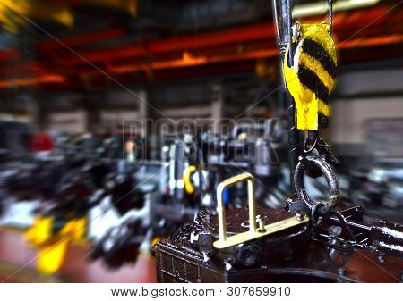 Crane Hook Of The Overhead Crane In The Workshop Of An Industrial Plant For The Production Of Tracto