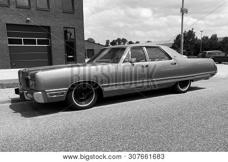 Woerden, The Netherlands - June 22, 2019: Green Chrysler New Yorker Parked By The Side Of The Road. 