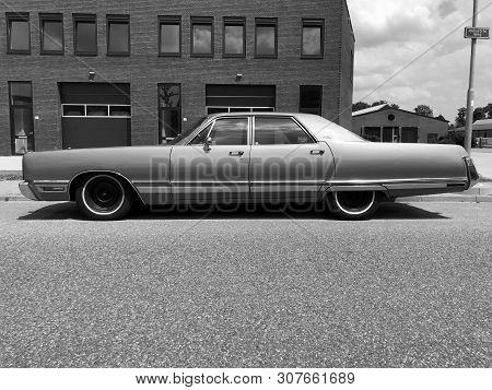 Woerden, The Netherlands - June 22, 2019: Chrysler New Yorker Parked By The Side Of The Road. Nobody