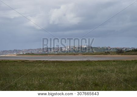 Beautiful Views Of The Buildings Of The Old Town Of Santander City From The Beach In Pedrena. August
