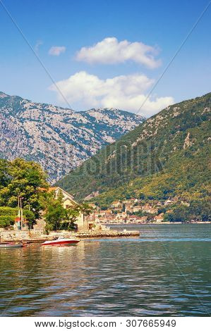 Sunny Summer Day On The Adriatic Coast. Montenegro, View Of Bay Of Kotor And Stoliv Village