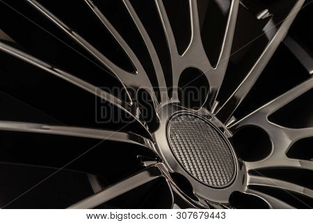 New Luxury Black Alloy Wheel, Sporty With Thin Spokes, Close-up On Black Background
