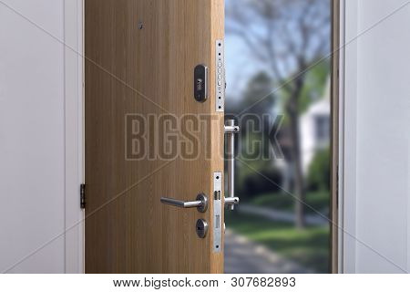 Security. Close-up Of The Lock A Armored Door. Open Door Of A Family Home.