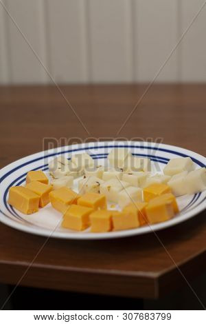 Pepperjack And Cheddar Cheese Cubes On A Serving Plate