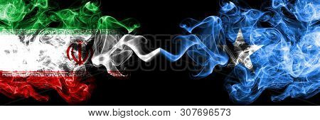 Iran Vs Somalia, Somalian Smoky Mystic States Flags Placed Side By Side. Thick Colored Silky Smokes 