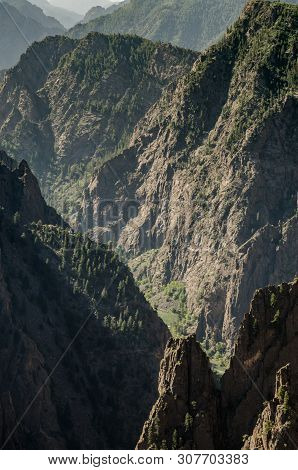 The Gunnison River Cuts Through Jagged Cliffs To Form Black Canyon Of The Gunnison