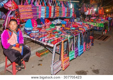 Mae Hong Son, Thailand - November 21st 2011: Woman Selling Hilltribe Products On The Night Market, M