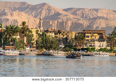 Luxor, Egypt 17.05.2018 View Of The Nile River West Bank Town Coastline With Sailboats In Luxor, Egy