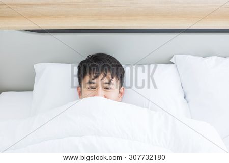 Close Up Shot Of Asian Handsome Man Lying On Comfort Bed, He Slept Deep In Bedroom.