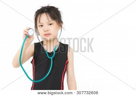 Pretty Asian Girl In Sportswear Wears Green Stechoscope And Posing To Camera, Studio Shot On White B
