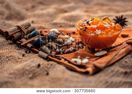 Famous Mango Preservation I.e. Murba Or Murabba In A Glass Bowl On Jute Bags Surface Along With Dry