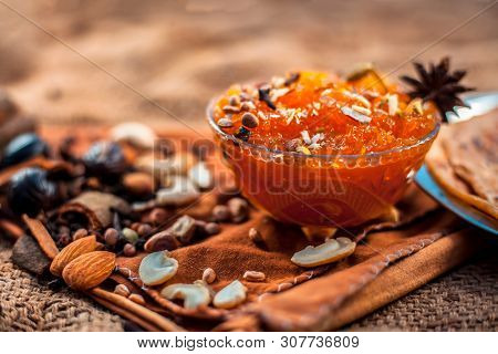 Famous Mango Preservation I.e. Murba Or Murabba In A Glass Bowl On Jute Bags Surface Along With Dry
