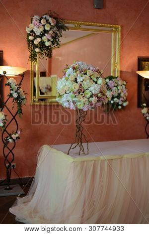 Bouquet Of Flowers On A Leg In The Interior Of The Restaurant For A Celebration Shop Floristry Or We